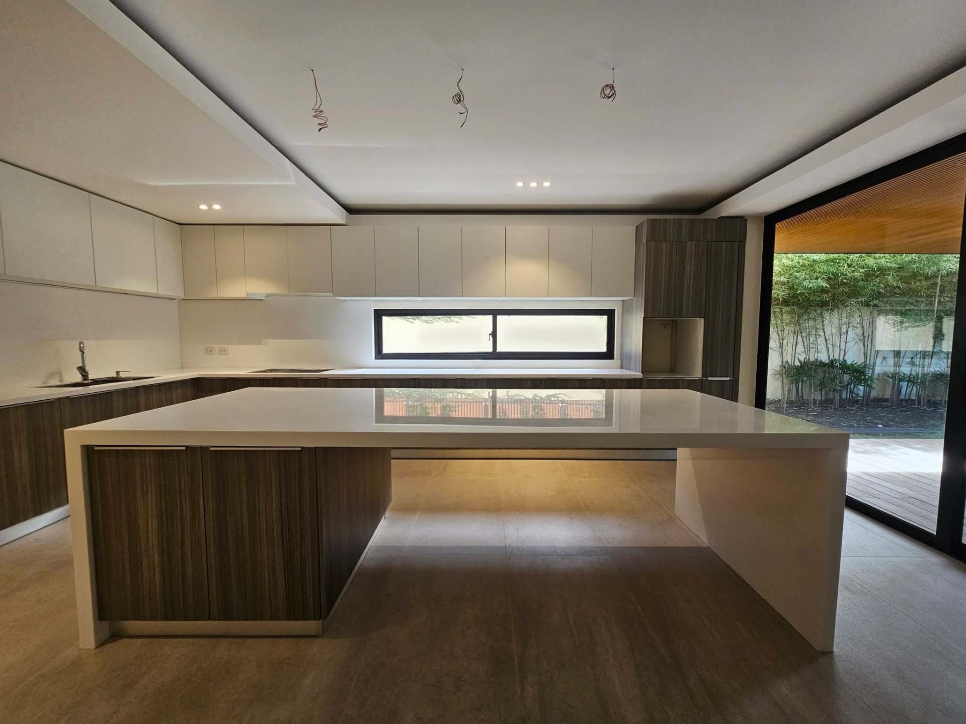 Scavolini kitchen with large island and bamboo garden view