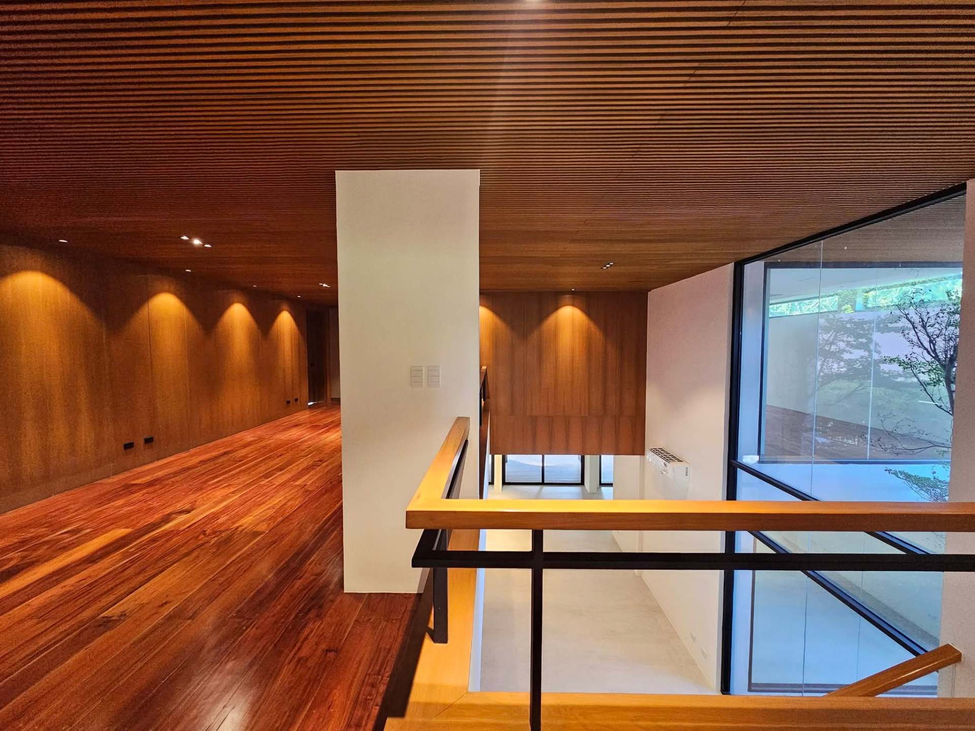 Attic / mezzanine with timber slat ceiling overlooking the void