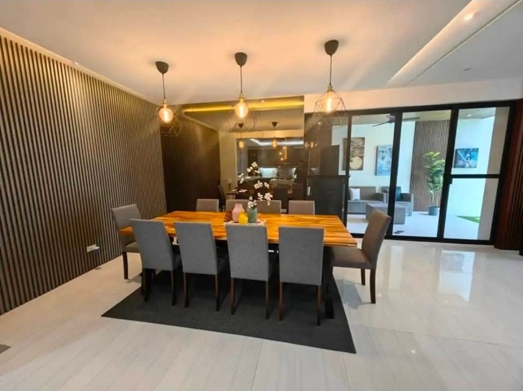 Formal dining room with sculptural pendant lighting