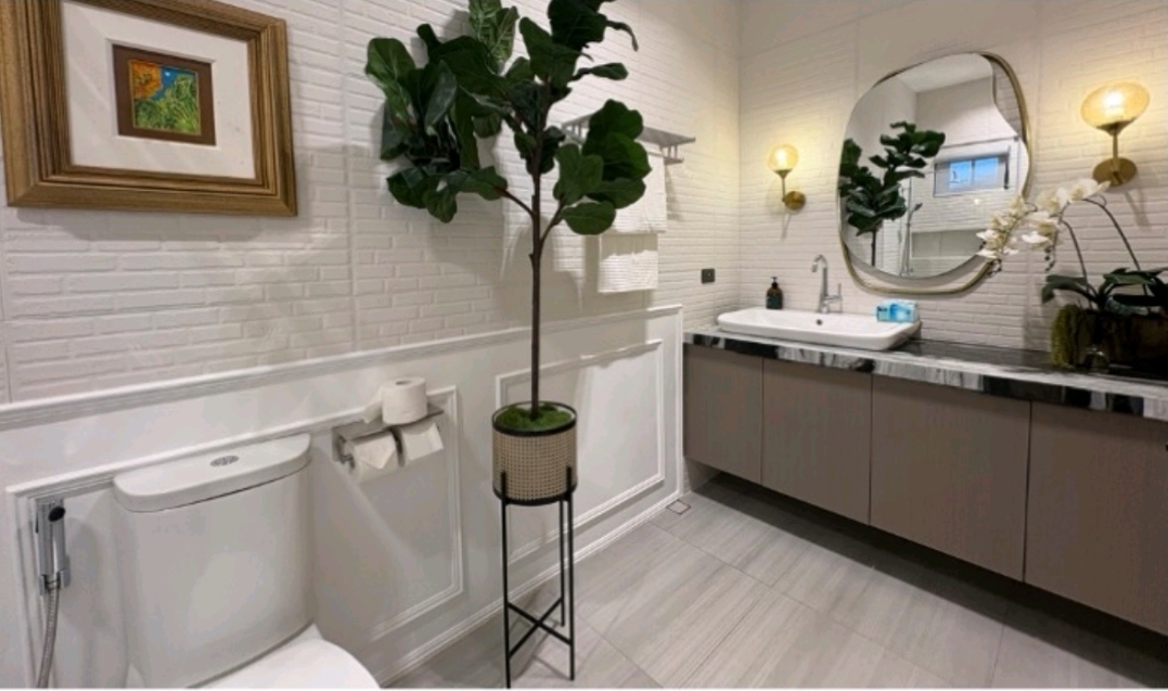 Guest powder room with brass fixtures