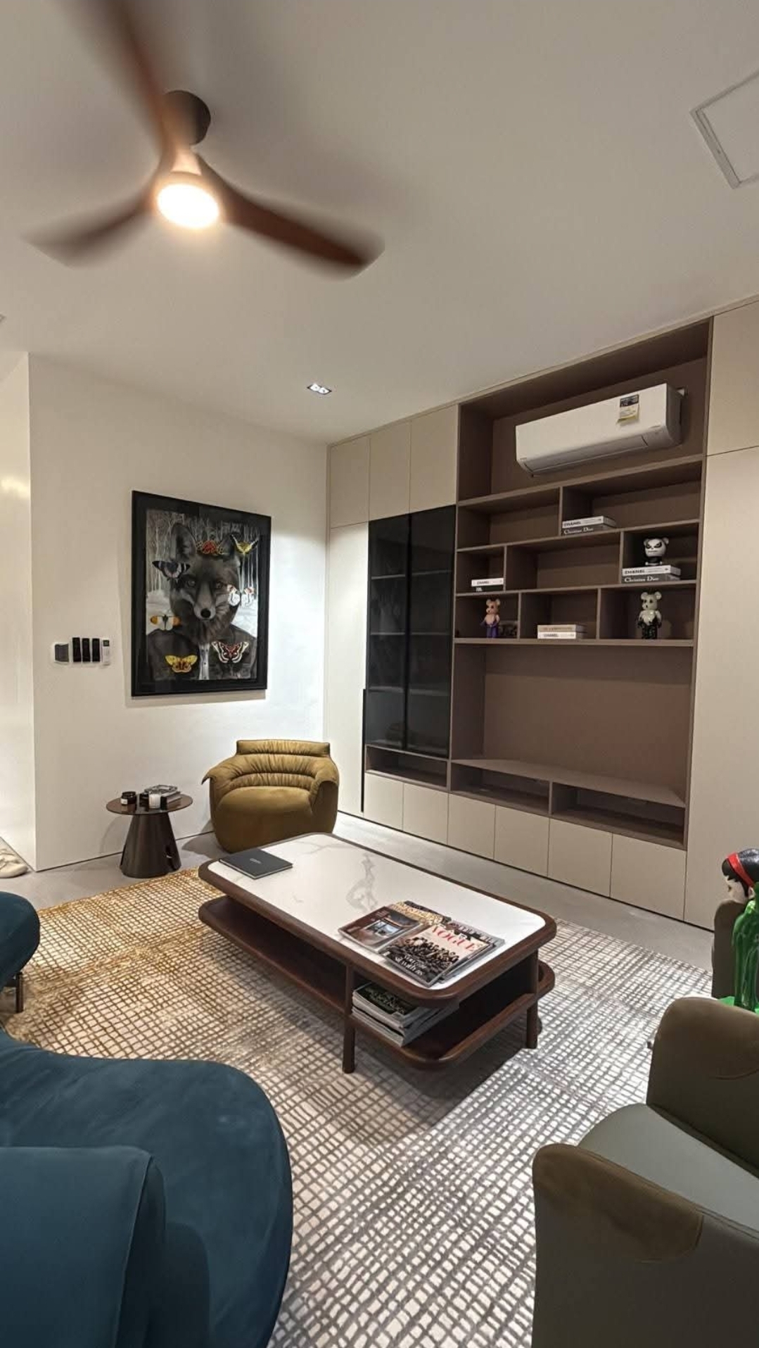 Family den with built-in cabinetry and reading nook