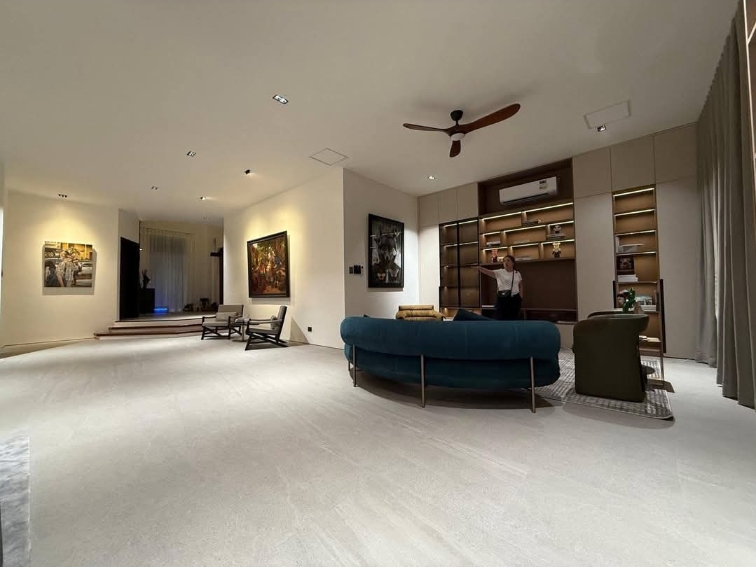 Spacious lounge with velvet sofa and curated artworks