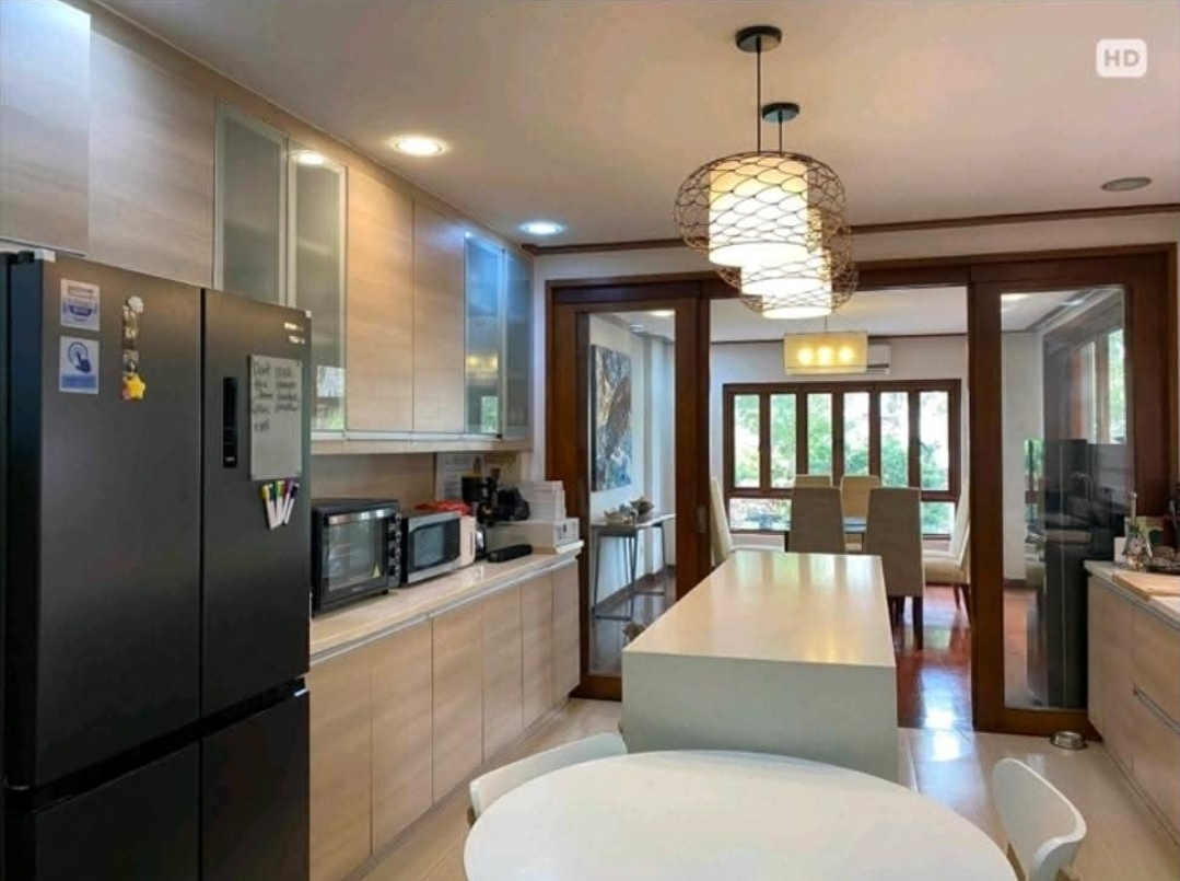 Spacious pantry with full-height fridge and prep counter