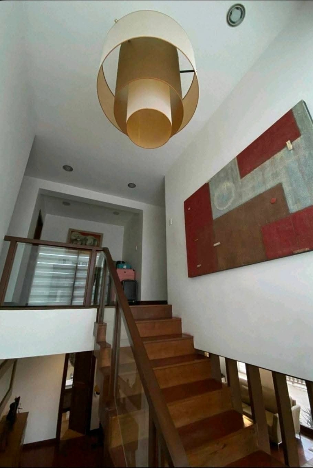 Sculptural staircase rising through the central atrium